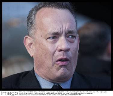 . 25 04 2016. London, United Kingdom. Tom Hanks feels the cold on the red carpet in London as he arrives for the premiere of his new film A Hologram for the King .  xStephenxLockx xi-Imagesx IIM-12507-0020