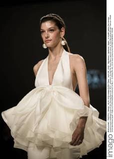 April 26, 2016 - Barcelona, Catalonia, Spain - A model walks the runway presenting a wedding dress of the Spring Summer 2017 collection during the Rosa Clara catwalk show at the Barcelona Bridal Fashion Week 2016 Barcelona Spain - ZUMAo105