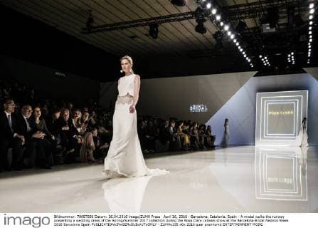 April 26, 2016 - Barcelona, Catalonia, Spain - A model walks the runway presenting a wedding dress of the Spring Summer 2017 collection during the Rosa Clara catwalk show at the Barcelona Bridal Fashion Week 2016 Barcelona Spain - ZUMAo105