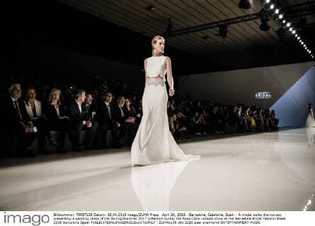 April 26, 2016 - Barcelona, Catalonia, Spain - A model walks the runway presenting a wedding dress of the Spring Summer 2017 collection during the Rosa Clara catwalk show at the Barcelona Bridal Fashion Week 2016 Barcelona Spain - ZUMAo105