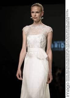 April 26, 2016 - Barcelona, Catalonia, Spain - A model walks the runway presenting a wedding dress of the Spring Summer 2017 collection during the Rosa Clara catwalk show at the Barcelona Bridal Fashion Week 2016 Barcelona Spain - ZUMAo105