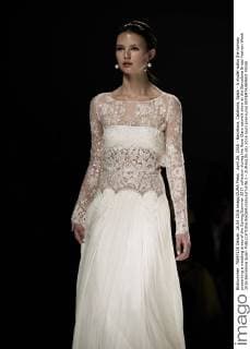 April 26, 2016 - Barcelona, Catalonia, Spain - A model walks the runway presenting a wedding dress of the Spring Summer 2017 collection during the Rosa Clara catwalk show at the Barcelona Bridal Fashion Week 2016 Barcelona Spain - ZUMAo105