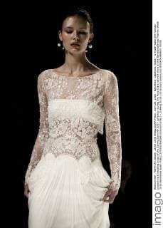 April 26, 2016 - Barcelona, Catalonia, Spain - A model walks the runway presenting a wedding dress of the Spring Summer 2017 collection during the Rosa Clara catwalk show at the Barcelona Bridal Fashion Week 2016 Barcelona Spain - ZUMAo105