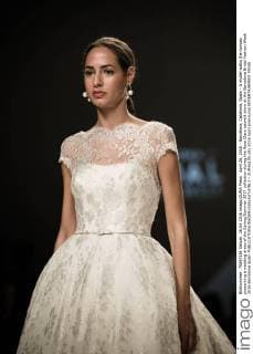 April 26, 2016 - Barcelona, Catalonia, Spain - A model walks the runway presenting a wedding dress of the Spring Summer 2017 collection during the Rosa Clara catwalk show at the Barcelona Bridal Fashion Week 2016 Barcelona Spain - ZUMAo105