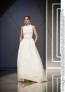 April 26, 2016 - Barcelona, Catalonia, Spain - A model walks the runway presenting a wedding dress of the Spring Summer 2017 collection during the Rosa Clara catwalk show at the Barcelona Bridal Fashion Week 2016 Barcelona Spain - ZUMAo105