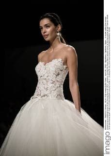 April 26, 2016 - Barcelona, Catalonia, Spain - A model walks the runway presenting a wedding dress of the Spring Summer 2017 collection during the Rosa Clara catwalk show at the Barcelona Bridal Fashion Week 2016 Barcelona Spain - ZUMAo105