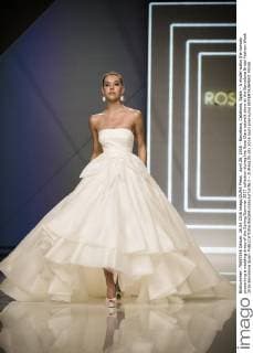 April 26, 2016 - Barcelona, Catalonia, Spain - A model walks the runway presenting a wedding dress of the Spring Summer 2017 collection during the Rosa Clara catwalk show at the Barcelona Bridal Fashion Week 2016 Barcelona Spain - ZUMAo105