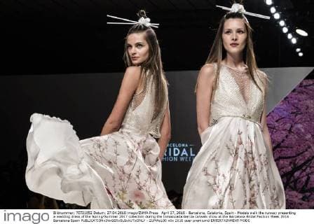April 27, 2016 - Barcelona, Catalonia, Spain - Models walk the runway presenting a wedding dress of the Spring Summer 2017 collection during the Inmaculada Garcia catwalk show at the Barcelona Bridal Fashion Week 2016 Barcelona Spain - ZUMAo105