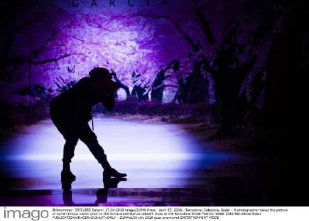 April 27, 2016 - Barcelona, Catalonia, Spain - A photographer takes the picture of some famous visitor prior to the Inmaculada Garcia catwalk show at the Barcelona Bridal Fashion Week 2016 Barcelona Spain - ZUMAo105