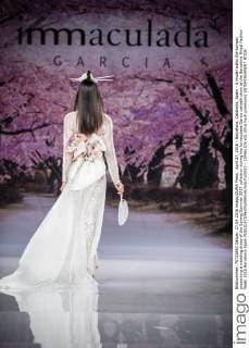 April 27, 2016 - Barcelona, Catalonia, Spain - A model walks the runway presenting a wedding dress of the Spring Summer 2017 collection during the Inmaculada Garcia catwalk show at the Barcelona Bridal Fashion Week 2016 Barcelona Spain - ZUMAo105