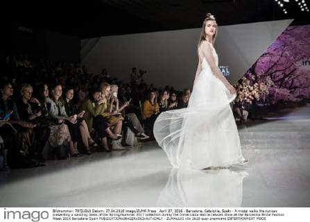 April 27, 2016 - Barcelona, Catalonia, Spain - A model walks the runway presenting a wedding dress of the Spring Summer 2017 collection during the Inmaculada Garcia catwalk show at the Barcelona Bridal Fashion Week 2016 Barcelona Spain - ZUMAo105