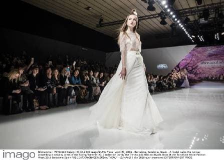 April 27, 2016 - Barcelona, Catalonia, Spain - A model walks the runway presenting a wedding dress of the Spring Summer 2017 collection during the Inmaculada Garcia catwalk show at the Barcelona Bridal Fashion Week 2016 Barcelona Spain - ZUMAo105