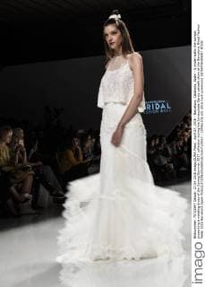 April 27, 2016 - Barcelona, Catalonia, Spain - A model walks the runway presenting a wedding dress of the Spring Summer 2017 collection during the Inmaculada Garcia catwalk show at the Barcelona Bridal Fashion Week 2016 Barcelona Spain - ZUMAo105