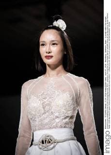April 27, 2016 - Barcelona, Catalonia, Spain - A model walks the runway presenting a wedding dress of the Spring Summer 2017 collection during the Inmaculada Garcia catwalk show at the Barcelona Bridal Fashion Week 2016 Barcelona Spain - ZUMAo105