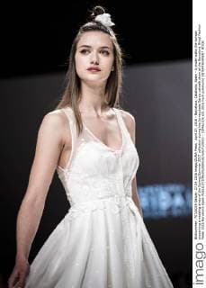 April 27, 2016 - Barcelona, Catalonia, Spain - A model walks the runway presenting a wedding dress of the Spring Summer 2017 collection during the Inmaculada Garcia catwalk show at the Barcelona Bridal Fashion Week 2016 Barcelona Spain - ZUMAo105