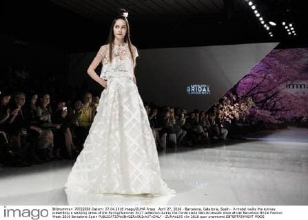 April 27, 2016 - Barcelona, Catalonia, Spain - A model walks the runway presenting a wedding dress of the Spring Summer 2017 collection during the Inmaculada Garcia catwalk show at the Barcelona Bridal Fashion Week 2016 Barcelona Spain - ZUMAo105