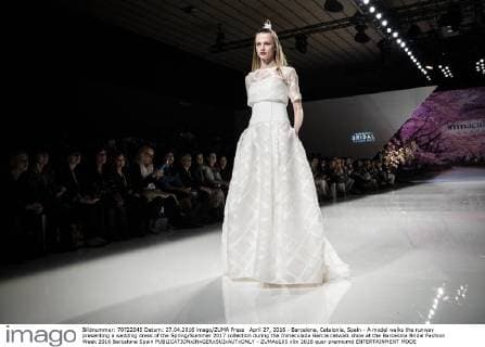 April 27, 2016 - Barcelona, Catalonia, Spain - A model walks the runway presenting a wedding dress of the Spring Summer 2017 collection during the Inmaculada Garcia catwalk show at the Barcelona Bridal Fashion Week 2016 Barcelona Spain - ZUMAo105