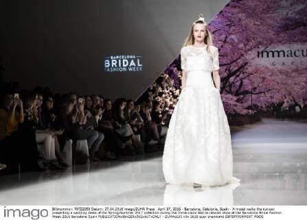 April 27, 2016 - Barcelona, Catalonia, Spain - A model walks the runway presenting a wedding dress of the Spring Summer 2017 collection during the Inmaculada Garcia catwalk show at the Barcelona Bridal Fashion Week 2016 Barcelona Spain - ZUMAo105