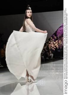 April 27, 2016 - Barcelona, Catalonia, Spain - A model walks the runway presenting a wedding dress of the Spring Summer 2017 collection during the Inmaculada Garcia catwalk show at the Barcelona Bridal Fashion Week 2016 Barcelona Spain - ZUMAo105
