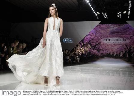 April 27, 2016 - Barcelona, Catalonia, Spain - A model walks the runway presenting a wedding dress of the Spring Summer 2017 collection during the Inmaculada Garcia catwalk show at the Barcelona Bridal Fashion Week 2016 Barcelona Spain - ZUMAo105