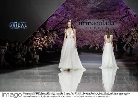 April 27, 2016 - Barcelona, Catalonia, Spain - Models walk the runway presenting a wedding dress of the Spring Summer 2017 collection during the Inmaculada Garcia catwalk show at the Barcelona Bridal Fashion Week 2016 Barcelona Spain - ZUMAo105