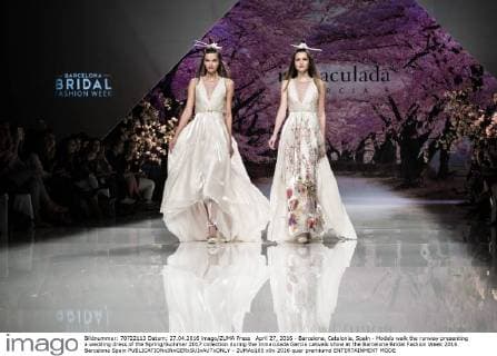 April 27, 2016 - Barcelona, Catalonia, Spain - Models walk the runway presenting a wedding dress of the Spring Summer 2017 collection during the Inmaculada Garcia catwalk show at the Barcelona Bridal Fashion Week 2016 Barcelona Spain - ZUMAo105