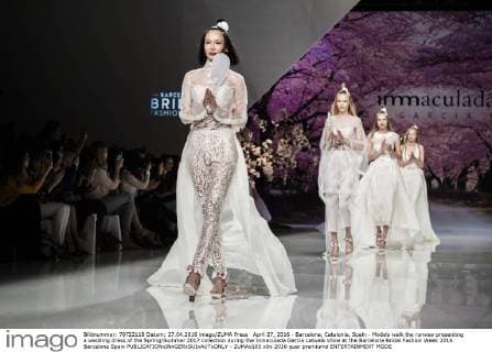 April 27, 2016 - Barcelona, Catalonia, Spain - Models walk the runway presenting a wedding dress of the Spring Summer 2017 collection during the Inmaculada Garcia catwalk show at the Barcelona Bridal Fashion Week 2016 Barcelona Spain - ZUMAo105