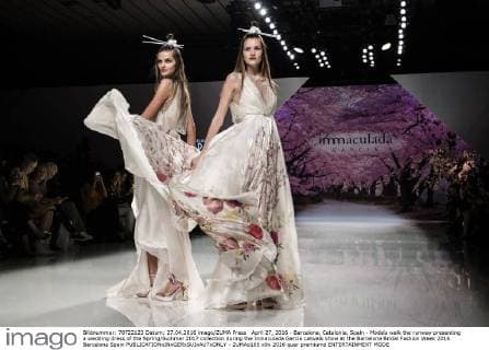 April 27, 2016 - Barcelona, Catalonia, Spain - Models walk the runway presenting a wedding dress of the Spring Summer 2017 collection during the Inmaculada Garcia catwalk show at the Barcelona Bridal Fashion Week 2016 Barcelona Spain - ZUMAo105