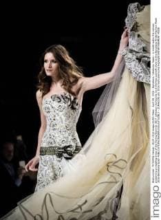 April 28, 2016 - Barcelona, Catalonia, Spain - A model walks the runway presenting a wedding dress of the Spring Summer 2017 collection during the Jordi Dalmau catwalk show at the Barcelona Bridal Fashion Week 2016 Barcelona Spain - ZUMAo105
