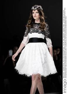 April 28, 2016 - Barcelona, Catalonia, Spain - A model walks the runway presenting a wedding dress of the Spring Summer 2017 collection during the Matilde Cano catwalk show at the Barcelona Bridal Fashion Week 2016 Barcelona Spain - ZUMAo105
