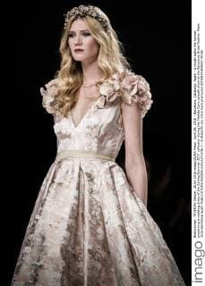 April 28, 2016 - Barcelona, Catalonia, Spain - A model walks the runway presenting a wedding dress of the Spring Summer 2017 collection during the Matilde Cano catwalk show at the Barcelona Bridal Fashion Week 2016 Barcelona Spain - ZUMAo105