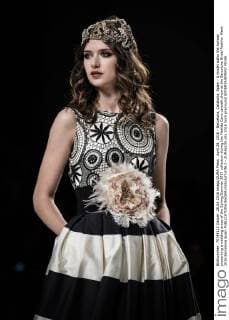 April 28, 2016 - Barcelona, Catalonia, Spain - A model walks the runway presenting a wedding dress of the Spring Summer 2017 collection during the Matilde Cano catwalk show at the Barcelona Bridal Fashion Week 2016 Barcelona Spain - ZUMAo105