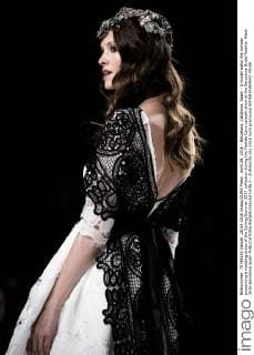 April 28, 2016 - Barcelona, Catalonia, Spain - A model walks the runway presenting a wedding dress of the Spring Summer 2017 collection during the Matilde Cano catwalk show at the Barcelona Bridal Fashion Week 2016 Barcelona Spain - ZUMAo105