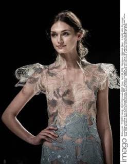 April 28, 2016 - Barcelona, Catalonia, Spain - A model walks the runway presenting a wedding dress of the Spring Summer 2017 collection during the Marco & Maria M&M catwalk show at the Barcelona Bridal Fashion Week 2016 Barcelona Spain - ZUMAo105