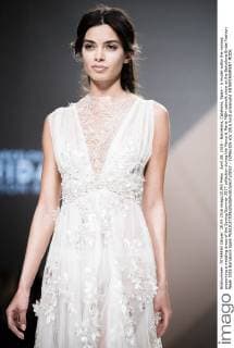 April 28, 2016 - Barcelona, Catalonia, Spain - A model walks the runway presenting a wedding dress of the Spring Summer 2017 collection during the Marco & Maria M&M catwalk show at the Barcelona Bridal Fashion Week 2016 Barcelona Spain - ZUMAo105