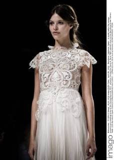April 28, 2016 - Barcelona, Catalonia, Spain - A model walks the runway presenting a wedding dress of the Spring Summer 2017 collection during the Marco & Maria M&M catwalk show at the Barcelona Bridal Fashion Week 2016 Barcelona Spain - ZUMAo105