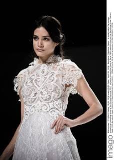 April 28, 2016 - Barcelona, Catalonia, Spain - A model walks the runway presenting a wedding dress of the Spring Summer 2017 collection during the Marco & Maria M&M catwalk show at the Barcelona Bridal Fashion Week 2016 Barcelona Spain - ZUMAo105