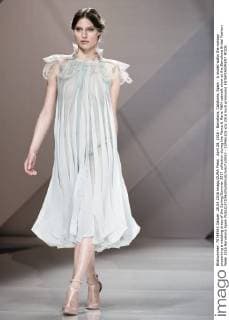 April 28, 2016 - Barcelona, Catalonia, Spain - A model walks the runway presenting a wedding dress of the Spring Summer 2017 collection during the Marco & Maria M&M catwalk show at the Barcelona Bridal Fashion Week 2016 Barcelona Spain - ZUMAo105