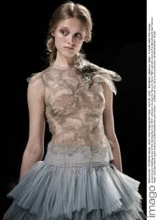 April 28, 2016 - Barcelona, Catalonia, Spain - A model walks the runway presenting a wedding dress of the Spring Summer 2017 collection during the Marco & Maria M&M catwalk show at the Barcelona Bridal Fashion Week 2016 Barcelona Spain - ZUMAo105