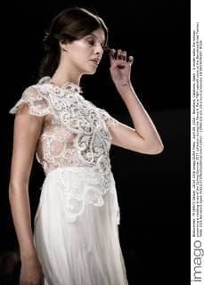 April 28, 2016 - Barcelona, Catalonia, Spain - A model walks the runway presenting a wedding dress of the Spring Summer 2017 collection during the Marco & Maria M&M catwalk show at the Barcelona Bridal Fashion Week 2016 Barcelona Spain - ZUMAo105