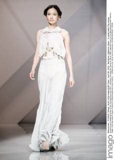 April 28, 2016 - Barcelona, Catalonia, Spain - A model walks the runway presenting a wedding dress of the Spring Summer 2017 collection during the Marco & Maria M&M catwalk show at the Barcelona Bridal Fashion Week 2016 Barcelona Spain - ZUMAo105