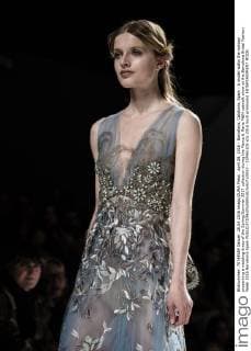 April 28, 2016 - Barcelona, Catalonia, Spain - A model walks the runway presenting a wedding dress of the Spring Summer 2017 collection during the Marco & Maria M&M catwalk show at the Barcelona Bridal Fashion Week 2016 Barcelona Spain - ZUMAo105