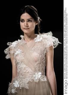 April 28, 2016 - Barcelona, Catalonia, Spain - A model walks the runway presenting a wedding dress of the Spring Summer 2017 collection during the Marco & Maria M&M catwalk show at the Barcelona Bridal Fashion Week 2016 Barcelona Spain - ZUMAo105