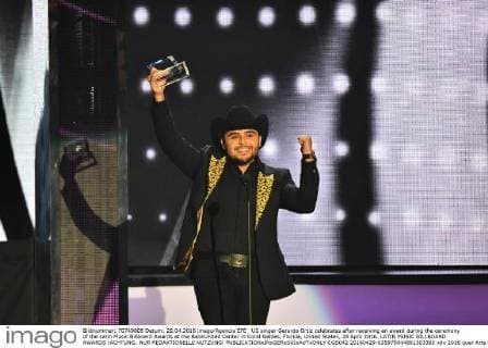 US singer Gerardo Ortiz celebrates after receiving an award during the ceremony of the Latin Music Billboard Awards at the BankUnited Center in Coral Gables, Florida, United States, 28 April 2016. LATIN MUSIC BILLBOARD AWARDS !ACHTUNG: NUR REDAKTIONELLE NUTZUNG!  CGS042 20160429-635975044881303365