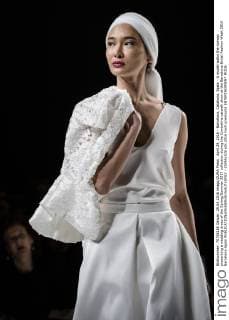 April 29, 2016 - Barcelona, Catalonia, Spain - A model walks the runway presenting a wedding dress of the Spring Summer 2017 collection during the Cymbeline catwalk show at the Barcelona Bridal Fashion Week 2016 Barcelona Spain - ZUMAo105