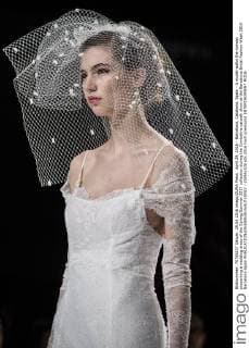 April 29, 2016 - Barcelona, Catalonia, Spain - A model walks the runway presenting a wedding dress of the Spring Summer 2017 collection during the Cymbeline catwalk show at the Barcelona Bridal Fashion Week 2016 Barcelona Spain - ZUMAo105