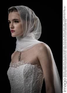 April 29, 2016 - Barcelona, Catalonia, Spain - A model walks the runway presenting a wedding dress of the Spring Summer 2017 collection during the Cymbeline catwalk show at the Barcelona Bridal Fashion Week 2016 Barcelona Spain - ZUMAo105
