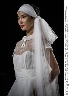 April 29, 2016 - Barcelona, Catalonia, Spain - A model walks the runway presenting a wedding dress of the Spring Summer 2017 collection during the Cymbeline catwalk show at the Barcelona Bridal Fashion Week 2016 Barcelona Spain - ZUMAo105