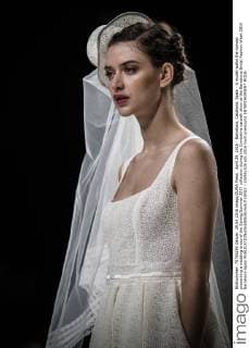 April 29, 2016 - Barcelona, Catalonia, Spain - A model walks the runway presenting a wedding dress of the Spring Summer 2017 collection during the Cymbeline catwalk show at the Barcelona Bridal Fashion Week 2016 Barcelona Spain - ZUMAo105
