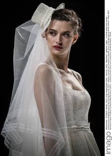 April 29, 2016 - Barcelona, Catalonia, Spain - A model walks the runway presenting a wedding dress of the Spring Summer 2017 collection during the Cymbeline catwalk show at the Barcelona Bridal Fashion Week 2016 Barcelona Spain - ZUMAo105